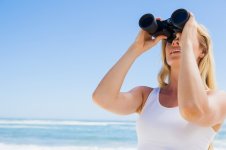 blonde-looking-through-binoculars-beach_13339-113024.jpg