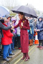 106699577-15595259-The_Princess_of_Wales_shelters_from_rain_under_a_umbrella_whilst-a-28_17721...jpg