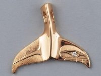 23557814-7902031-On_the_visit_Meghan_was_gifted_an_18ct_gold_and_diamond_whale_ta-a-34_1579353...jpg