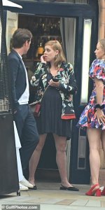 46694577-9895217-Beatrice_appeared_to_be_deep_in_thought_as_she_chatted_with_her_-a-63_1629023...jpg