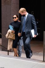 48309511-10020855-Meghan_slung_her_camel_colored_Max_Mara_coat_over_her_arm_as_the-a-15_163243...jpg