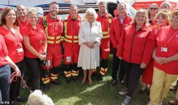 58920193-10904463-The_Duchess_of_Cornwall_poses_with_the_Cornwall_Air_Ambulance_st-a-250_16548...jpg