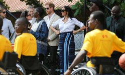 84764323-13409029-Meghan_and_Harry_stood_on_the_sidelines_as_young_people_took_par-m-46_171552...jpg