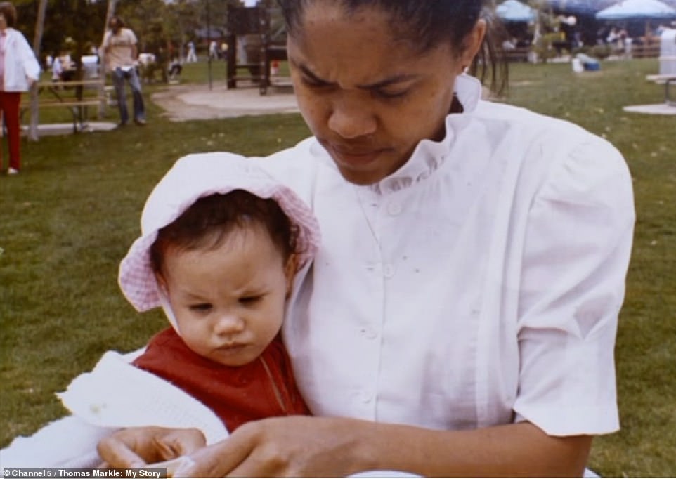 23766638-7919863-Meghan_is_cuddled_by_her_mother_Doria_on_a_sunny_Californian_day-a-133_1579774858166.jpg