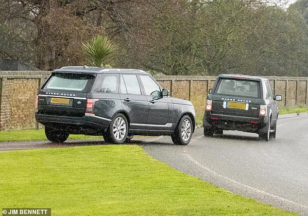 Pictured: The Range Rovers back up before the Windsor Castle gate opens, causing both vehicles to perform a U-turn and enter the estate