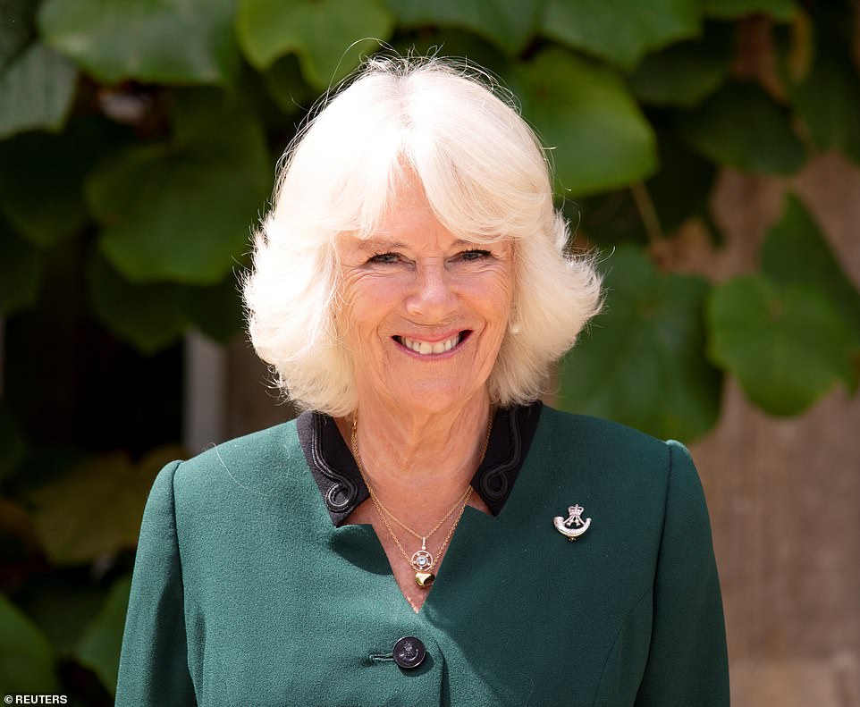 31061164-8548389-The_Duchess_of_Cornwall_smiles_as_she_becomes_Colonel_in_Chief_f-a-16_1595435668827.jpg