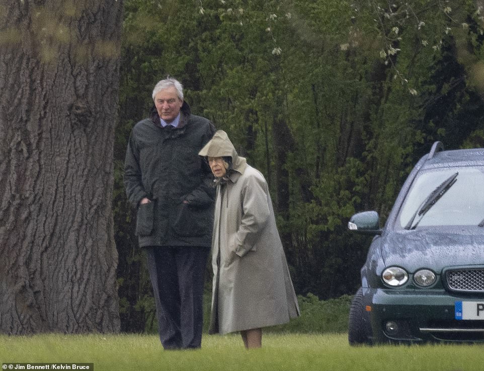42414640-9529953-The_Queen_appeared_in_high_spirits_despite_the_pouring_rain_and_-a-214_1619792345904.jpg