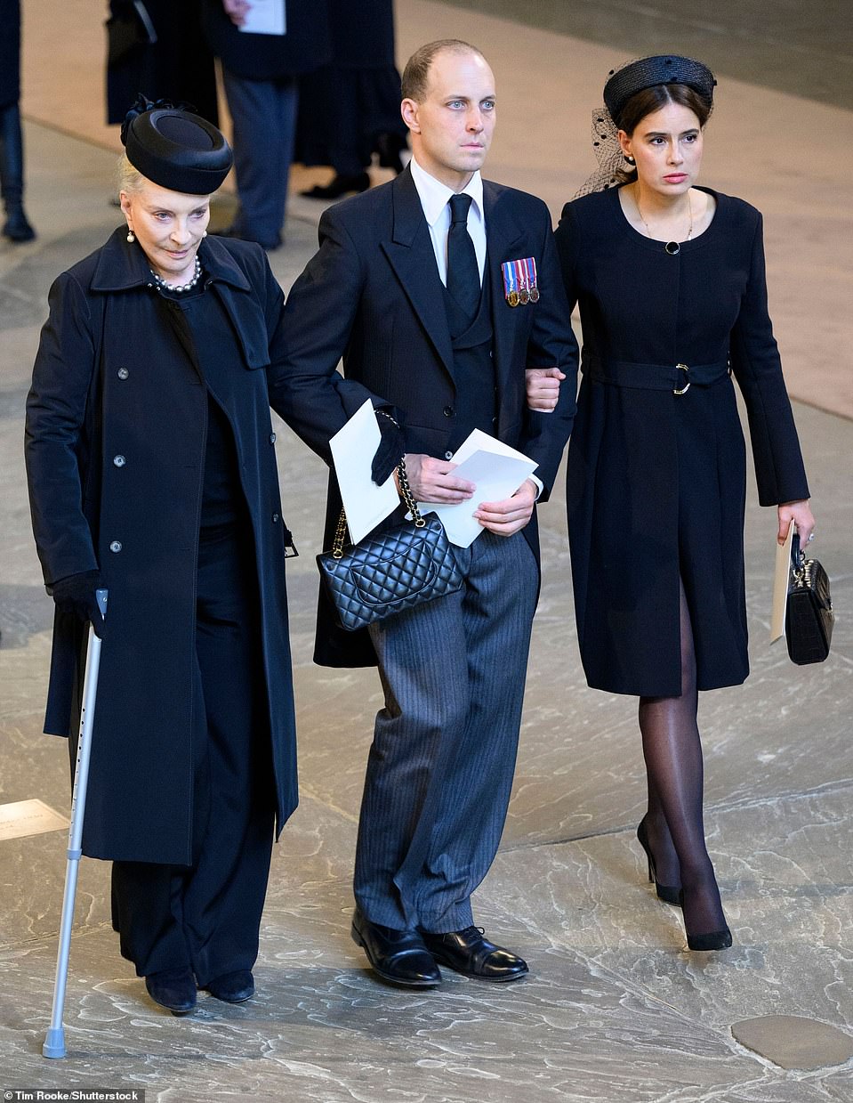 62412669-11211879-Lord_Frederick_Windsor_centre_attends_the_service_with_his_wife_-a-13_1663185143509.jpg